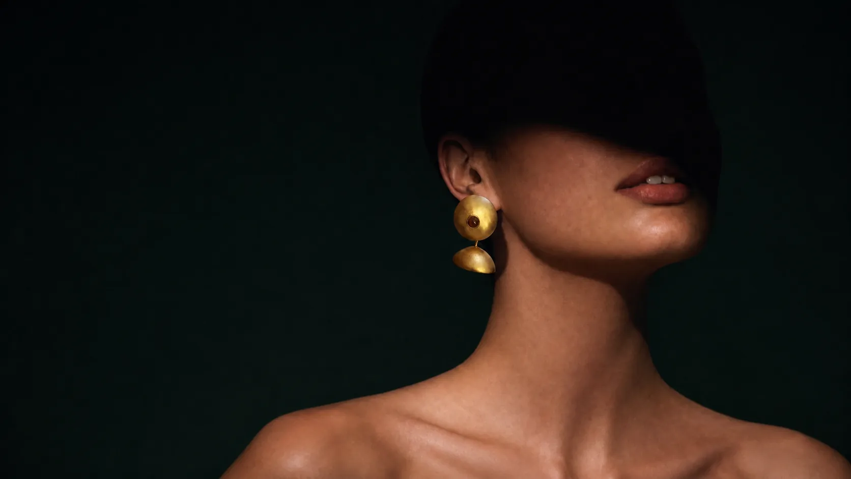A sculptural brass earring
