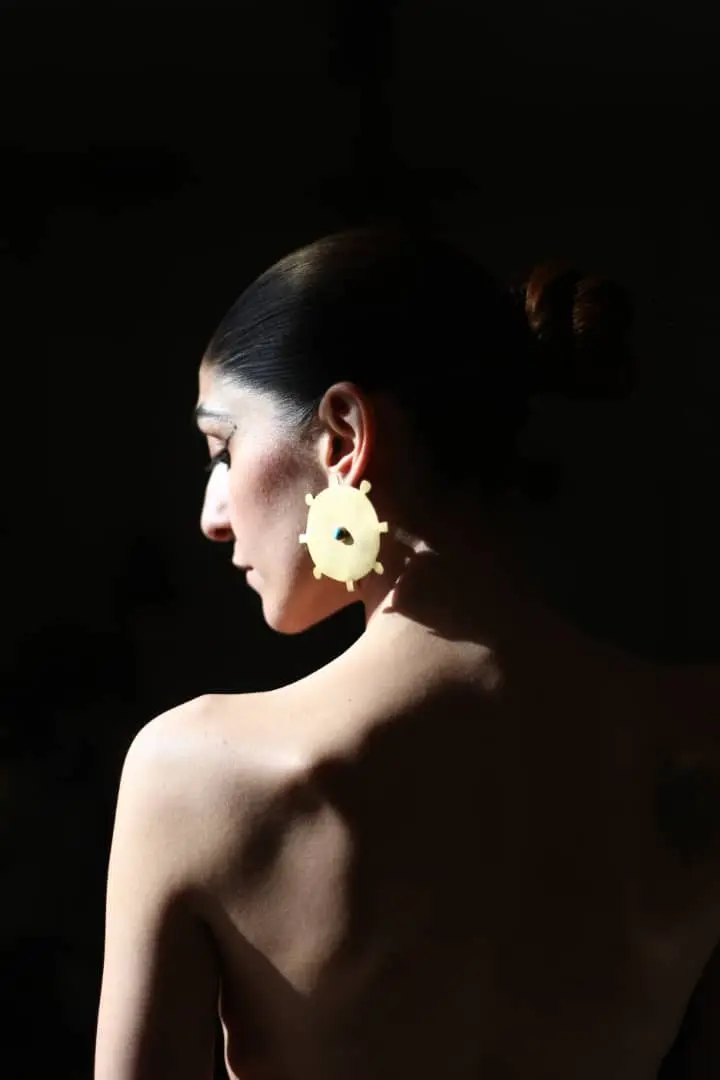 A Hoor earring worn from behind